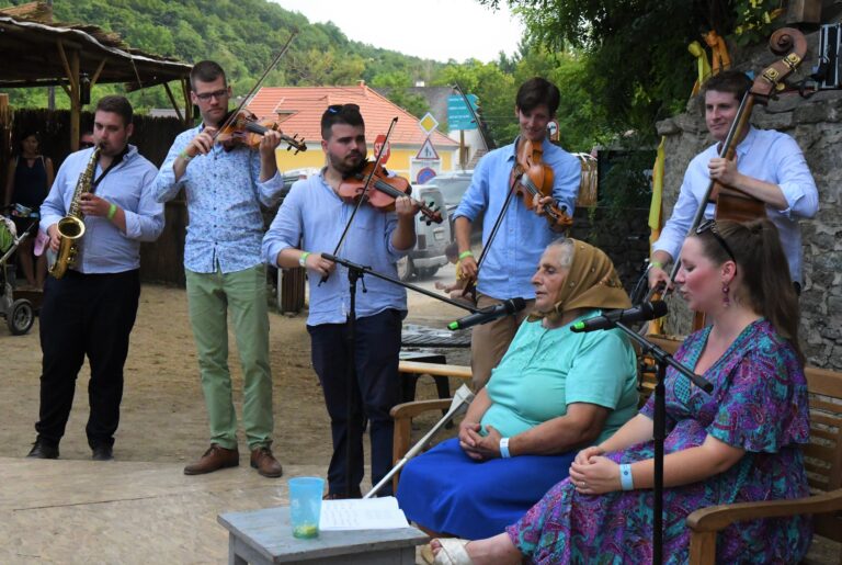 Old and young womean with band in a village CREDIT Hont Angela