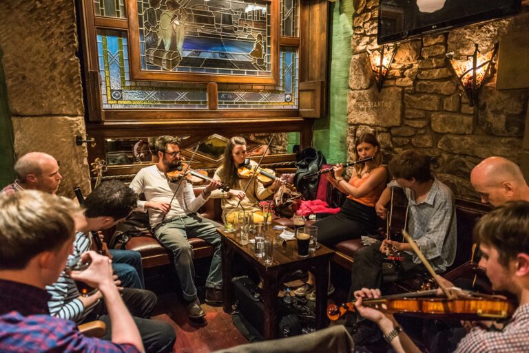 Pub session with musicians around a table